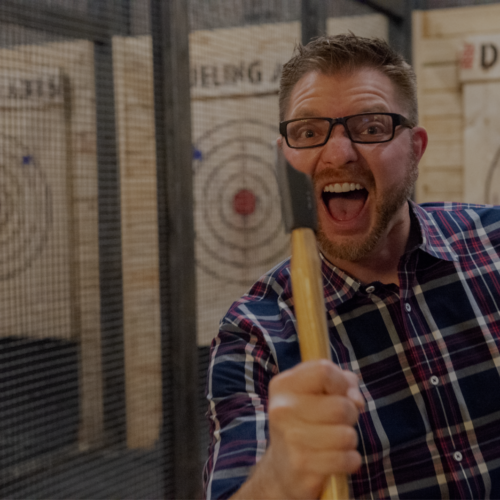 man at dueling axes