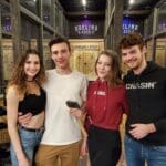Friends enjoying axe throwing